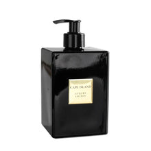 Load image into Gallery viewer, Black lotion bottle with pump and 'Cape Island' branding on a white background