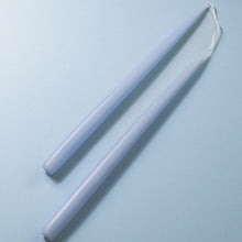Load image into Gallery viewer, 2 light blue taper candles on a light blue background