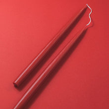 Load image into Gallery viewer, 2 red candles on a red background