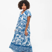 Load image into Gallery viewer, Woman wearing a blue and white patterned dress on a white background