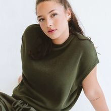 Load image into Gallery viewer, Woman wearing a green sweater against a white background