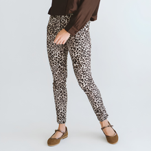 Load image into Gallery viewer, Person wearing leopard print pants on a plain background