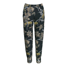 Load image into Gallery viewer, Black pants with gold animal print on a white background