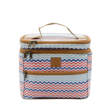 Load image into Gallery viewer, Stand up toiletry bag with blue, white & red zigzag pattern & brown handles and zippers on a white background