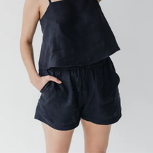 Load image into Gallery viewer, Person wearing a black sleeveless top and shorts on a plain background