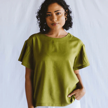 Load image into Gallery viewer, Woman wearing a green shirt against a plain background