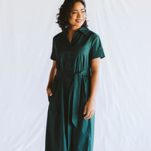 Load image into Gallery viewer, Woman wearing a green dress against a white background