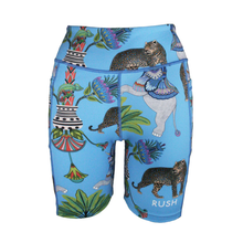 Load image into Gallery viewer, Colorful athletic shorts with animal and plant pattern on a blue background