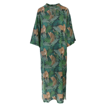 Load image into Gallery viewer, A loose, short-sleeved maxi dress with a green tropical leaf print and leopard motifs, shown against a plain white background.