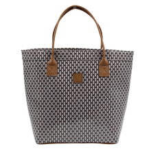 Load image into Gallery viewer, A structured tote bag featuring a brown and white geometric patterned body with smooth brown leather handles and a small brown logo patch on the front, set against a plain white background.