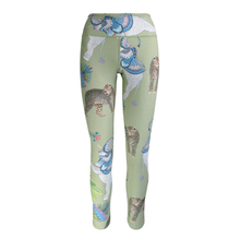 Load image into Gallery viewer, Leggings with animal print on a green background