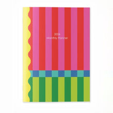 Load image into Gallery viewer, Colorful striped planner with '2024 Monthly Planner' text on a white background
