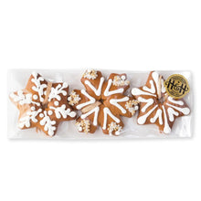 Load image into Gallery viewer, Packaged star-shaped gingerbread cookies with white icing and gold accents on a white background