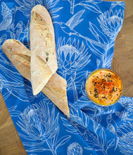 Load image into Gallery viewer, A Love Supreme Tea Towel - Bloom Essence Cream on Blue
