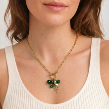 Load image into Gallery viewer, Gold necklace with green pendant worn by a person
