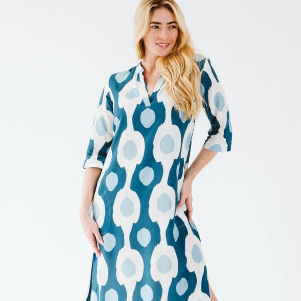 Woman wearing a teal blue and white patterned Trinity Boho Dress 