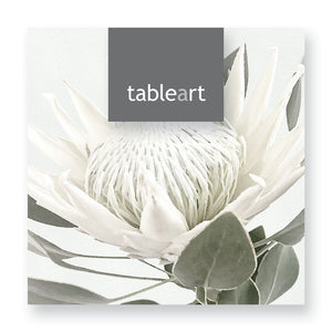 Coasters with white king protea print with 'tableart' logo on a white background