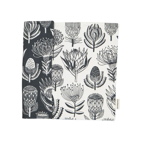 A Love Supreme Floral patterned fabric placemats with grey and white protea design on a white background