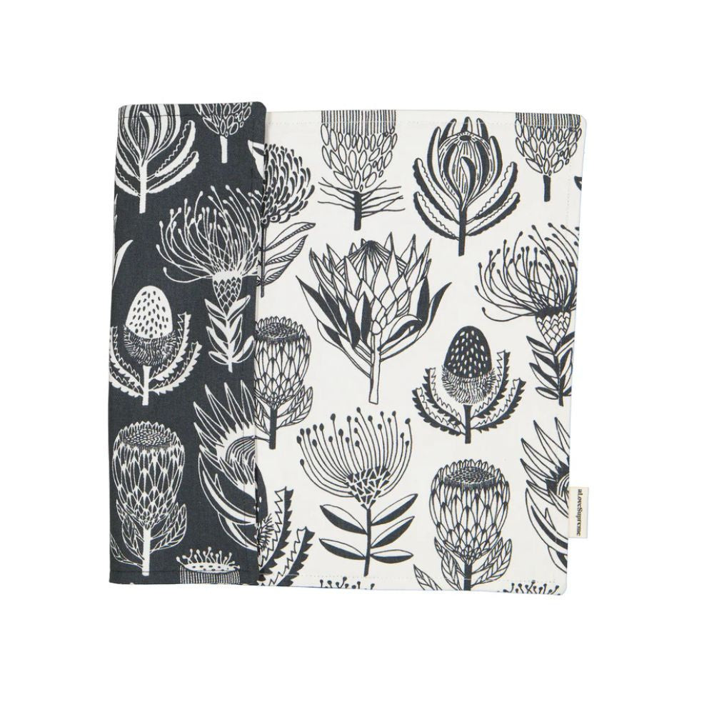 A Love Supreme Floral patterned fabric placemats with grey and white protea design on a white background