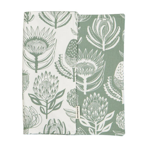A Love Supreme fabric placemat with green & white floral pattern on a white background