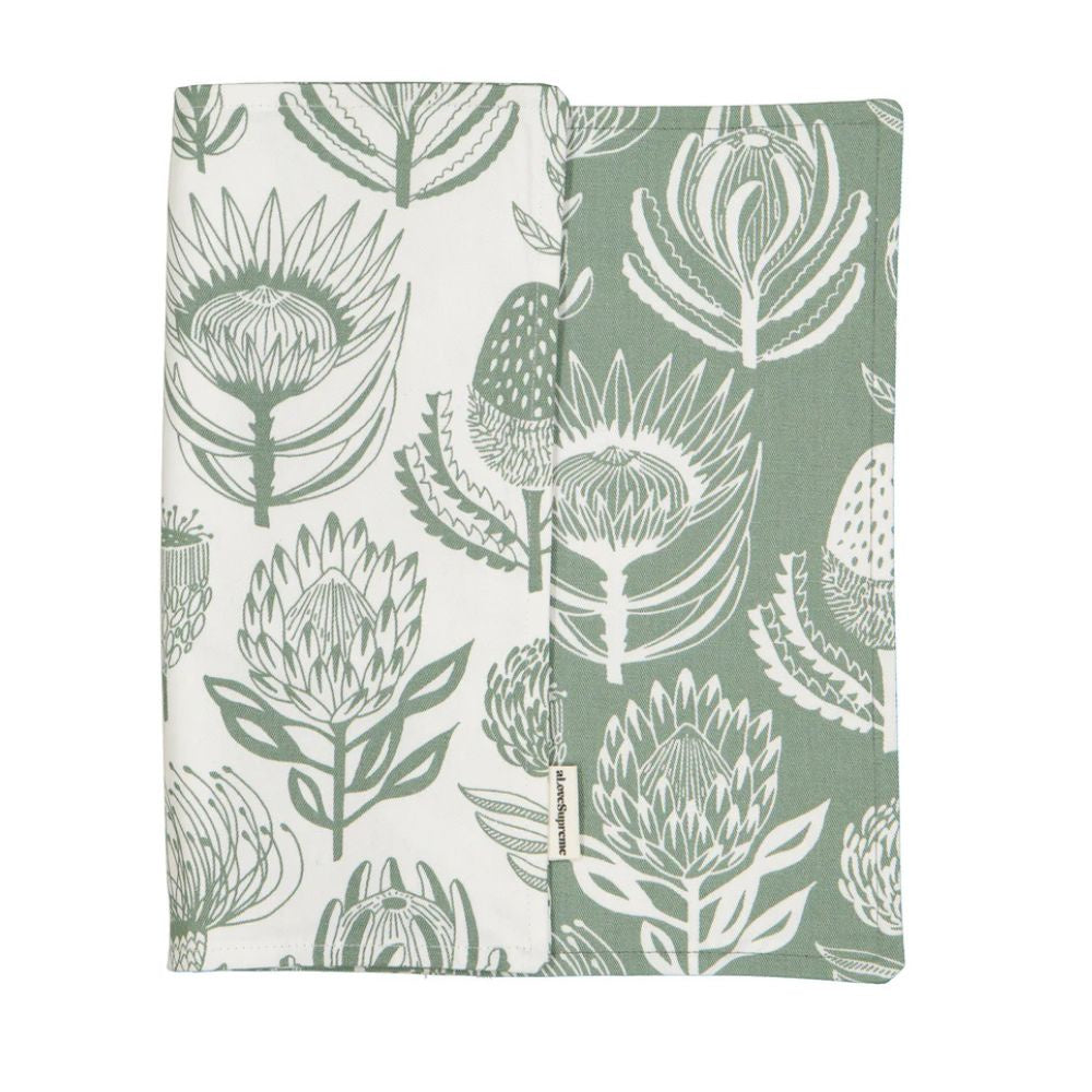 A Love Supreme fabric placemat with green & white floral pattern on a white background