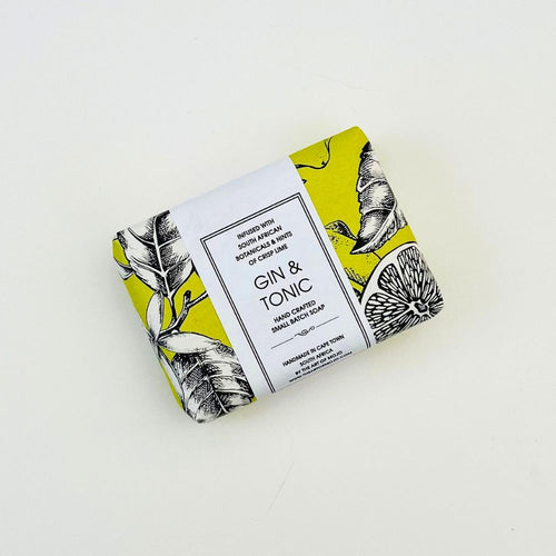 Bar of soap with 'Gin & Tonic' label and lemon design on a white background