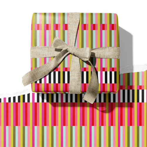 Gift box with colorful striped wrapping paper and a bow on a white background