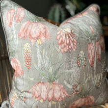 Load image into Gallery viewer, JW Designs Aloe cushion cover with pink flowers on a sage green background with matching piping
