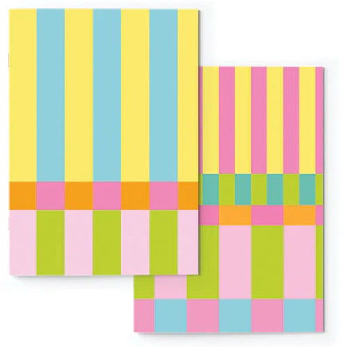 Two colorful checkered notebooks with a geometric pattern on a white background.