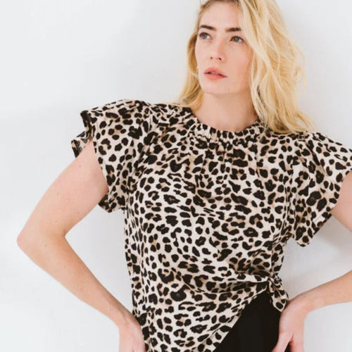 Woman wearing leopard print blouse