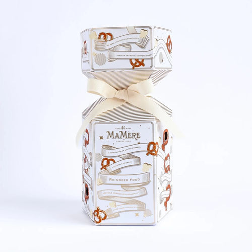 Decorative packaging of MaMère reindeer food with a bow on a white background