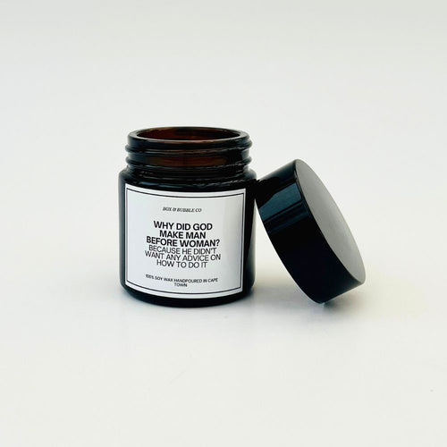 Black jar candle with a humorous label on a white background