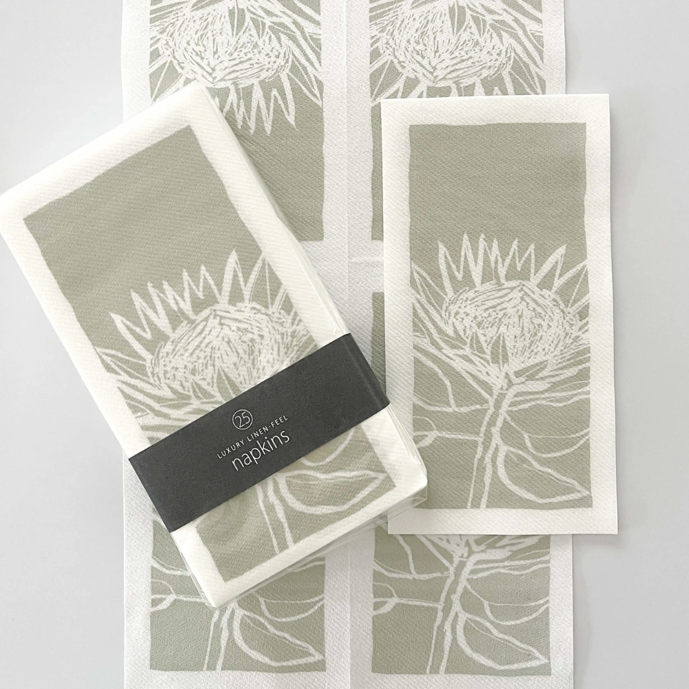 Set of 25 Tableart linen feel slim napkins with white protea image on a sage green background
