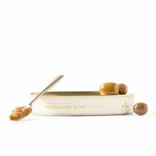 Load image into Gallery viewer, Tin of Nocellara olive hummus with a spoon and olives on a white background
