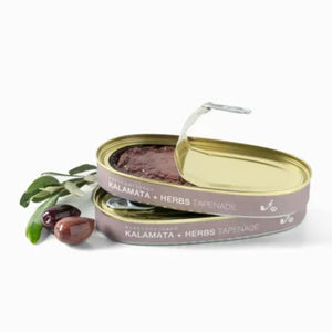 Two tins of Babylonstoren Kalamata + Herbs Tapenade with a white background