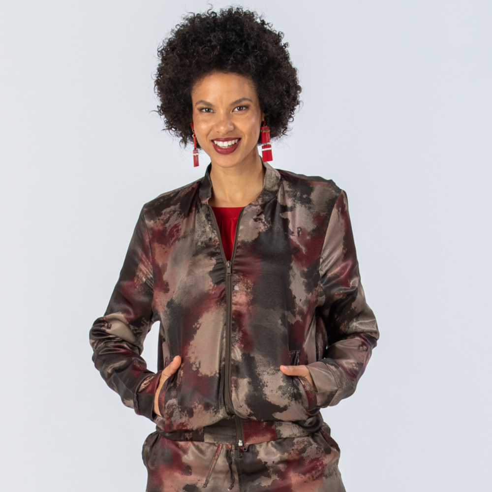 Woman wearing the Signature by Des New York Bomber Jacket in Red Fatigue