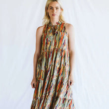 Load image into Gallery viewer, Woman wearing a colorful patterned dress against a white background
