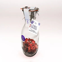 Load image into Gallery viewer, Glass carafe with strawberry, jasmine, &amp; cornflower dried fruit infusion
