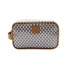 Load image into Gallery viewer, Patterned toiletry bag with a brown strap and logo on a white background

