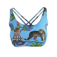 Load image into Gallery viewer, Blue sports bra with a leopard and floral design on a white background
