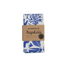 Load image into Gallery viewer, Set of two blue and white floral napkins with a cardboard packaging label on a white background
