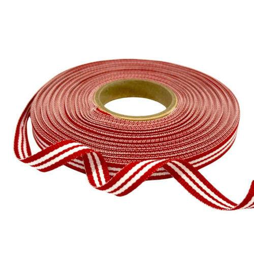 Roll of red and white striped ribbon on a white background