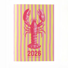 Load image into Gallery viewer, 2026 monthly planner with a pink lobster design on a striped yellow and pink background
