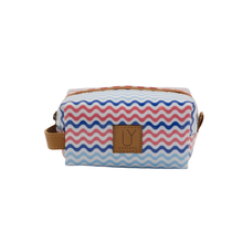 Load image into Gallery viewer, Cosmetic bag with blue, red &amp; white zigzag pattern and brown strap on a white background
