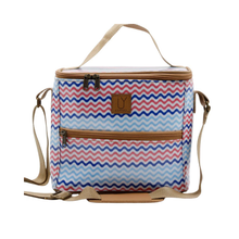Load image into Gallery viewer, Cooler bag with red, blue, &amp; white zigzag pattern and brown straps on a white background
