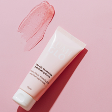 Load image into Gallery viewer, Lumi Glo Cleansing Exfoliating balm tube with pink cream on a pink background
