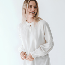 Load image into Gallery viewer, Woman wearing a white blouse against a plain background
