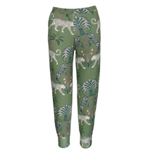 Load image into Gallery viewer, Green leggings with animal pattern on a white background
