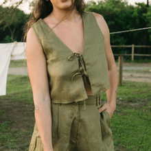 Load image into Gallery viewer, Person wearing an olive green sleeveless top and pants outdoors.
