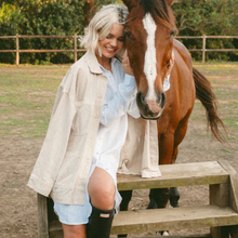 Load image into Gallery viewer, Woman standing next to a horse in an outdoor setting
